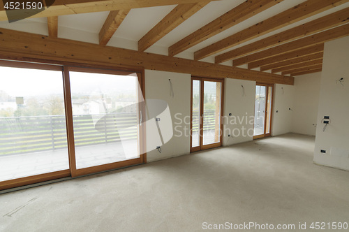Image of Home renovation: large open space with exposed wooden beams
