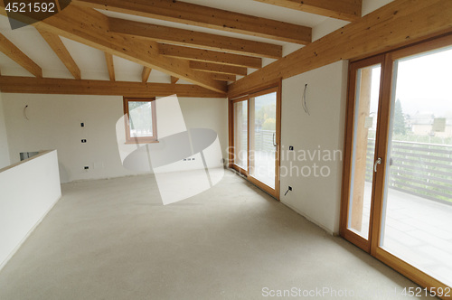 Image of Home renovation: large open space with exposed wooden beams