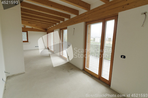 Image of Home renovation: large open space with exposed wooden beams