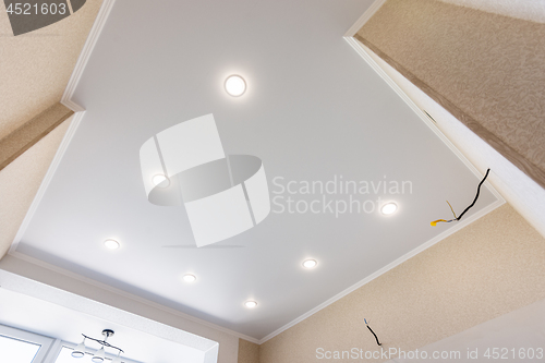 Image of Stretch ceiling in the kitchen with installed and included spotlights