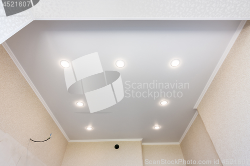 Image of Stretch ceiling in the kitchen with installed and included spotlights