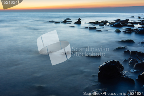 Image of Rocky sea beach after sunset, Black Sea, Anapa, Russia