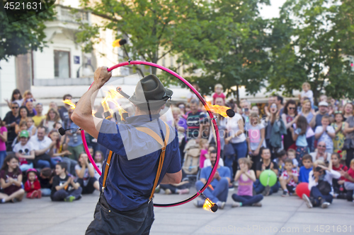 Image of Street performer with a fire wheel 