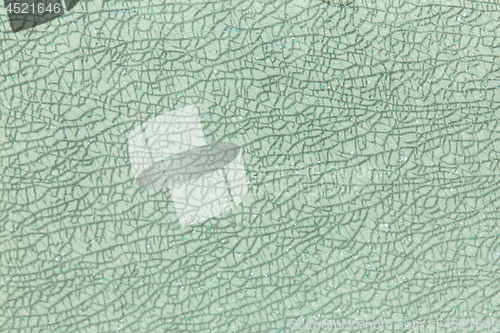 Image of background of broken glass surface with cracks
