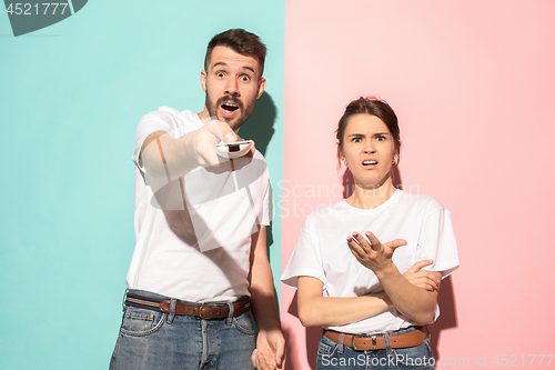 Image of Closeup portrait of young couple, man, woman. One being excited 