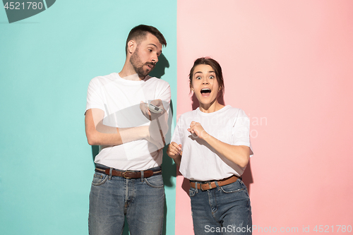 Image of Closeup portrait of young couple, man, woman. One being excited 