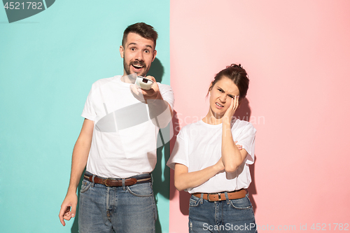 Image of Closeup portrait of young couple, man, woman. One being excited 