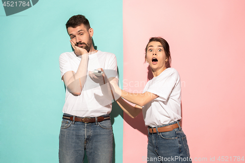 Image of Closeup portrait of young couple, man, woman. One being excited 