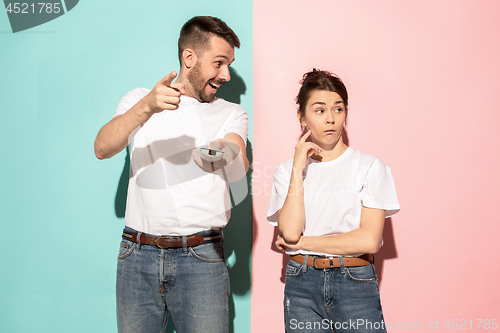 Image of Closeup portrait of young couple, man, woman. One being excited 