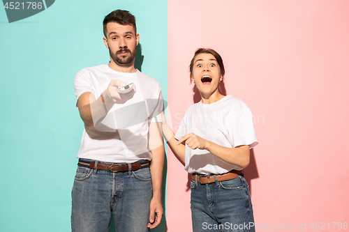 Image of Closeup portrait of young couple, man, woman. One being excited 