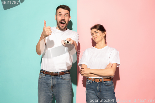 Image of Closeup portrait of young couple, man, woman. One being excited 