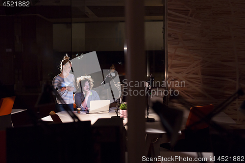Image of young designers in the night office