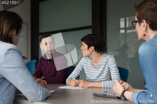 Image of Business Team At A Meeting at modern office building