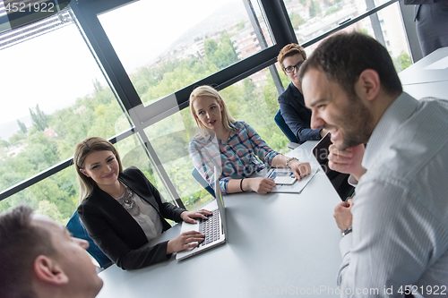 Image of Group of young people meeting in startup office