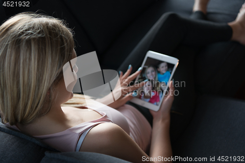 Image of woman using tablet in beautiful apartment