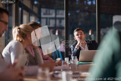 Image of Business Team At A Meeting at modern office building