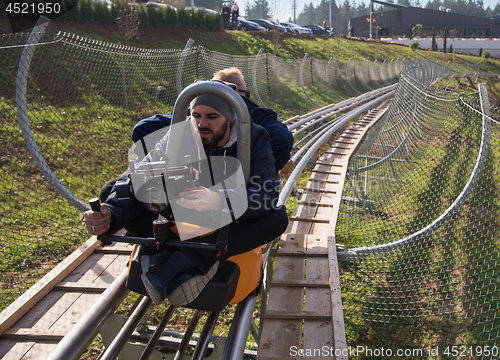 Image of videographer at work on alpine coaster