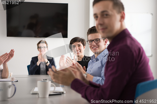 Image of Group of young people meeting in startup office