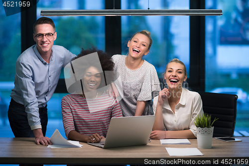 Image of Multiethnic startup business team in night office