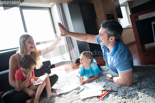 Image of young couple spending time with kids