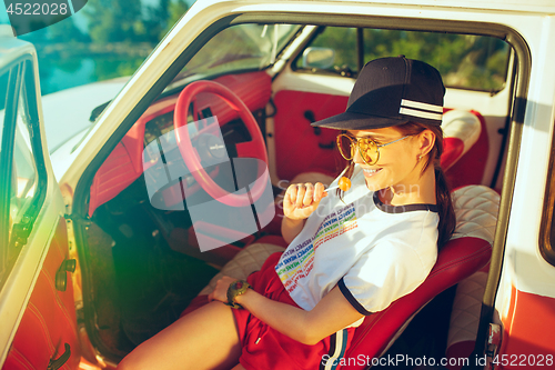 Image of Woman and happy trip by car