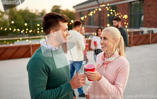 Image of friends with non alcoholic drinks at rooftop party