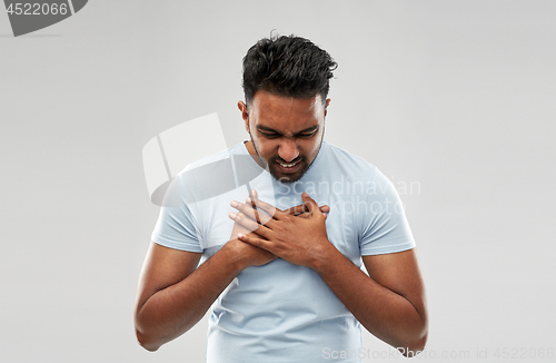 Image of unhappy man suffering from heartache