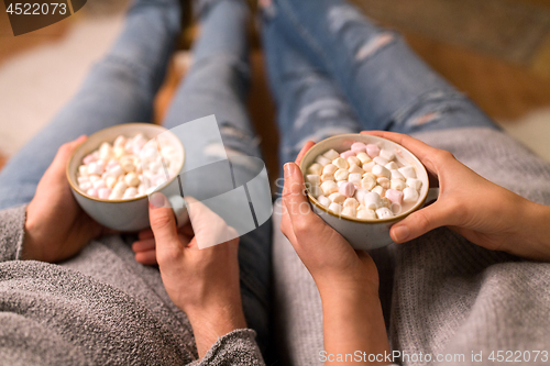 Image of close up of couple drinking hot chocolate at home