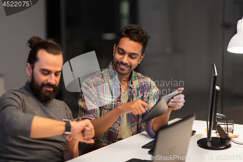 Image of creative team with tablet pc working at office