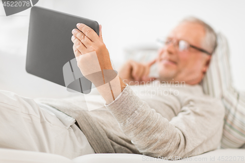 Image of close up of senior man with tablet computer