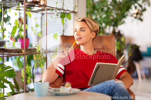 Image of teenage girl with notebook at coffee shop or cafe