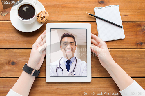 Image of patient having video call with doctor on tablet pc