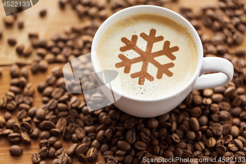 Image of coffee cup with snowflake and roasted beans