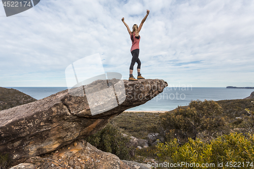Image of Hiker in national park arms outstretched feel on top of the world