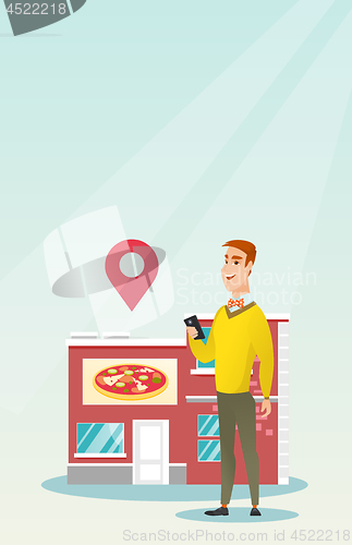 Image of Man looking for a restaurant in his smartphone.