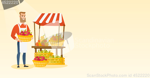 Image of Greengrocer holding box full of apples.