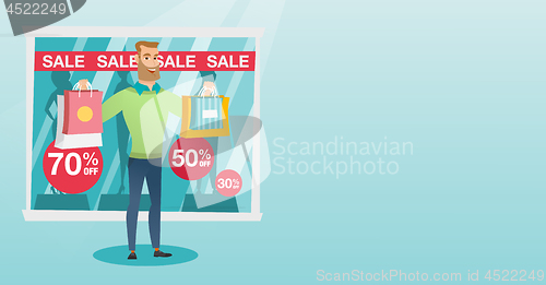 Image of Young caucasian man shopping on sale.