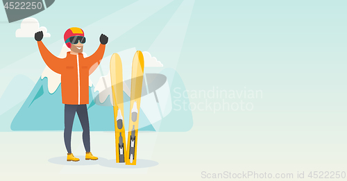 Image of Young caucasian skier standing with raised hands.