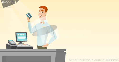 Image of Caucasian cashier holding a credit card.