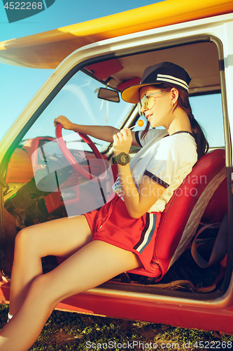 Image of Woman and happy trip by car