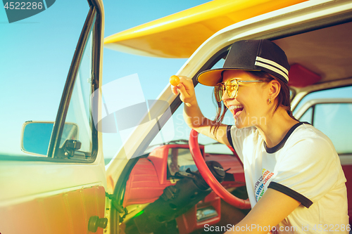 Image of Woman and happy trip by car