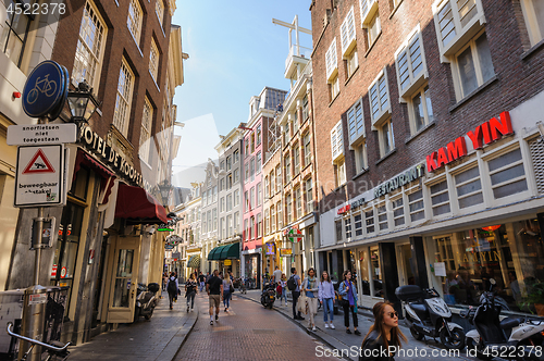 Image of People at streets of Amsterdam during spring time