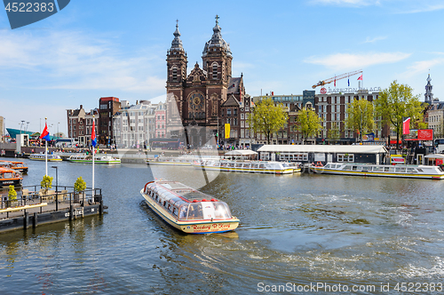 Image of Sightseeng at Canal Boats near the Central Station of Amsterdam