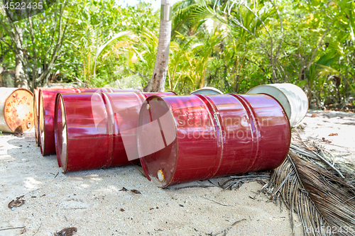 Image of oil drum barrels on beach in french polynesia