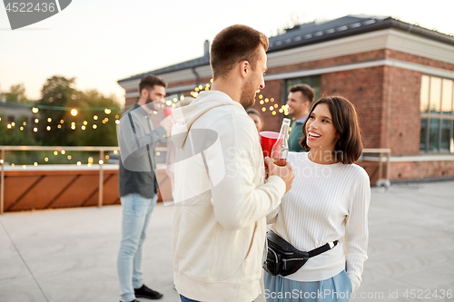 Image of friends with non alcoholic drinks at rooftop party