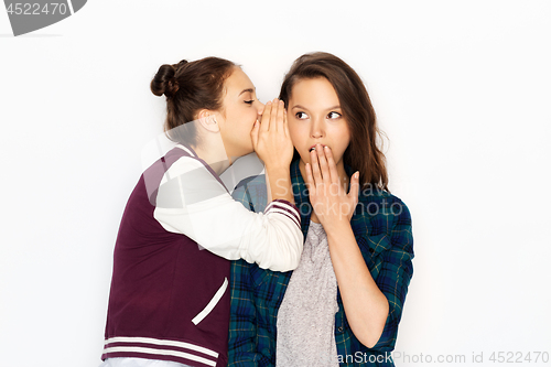 Image of teenage girls gossiping or sharing secrets