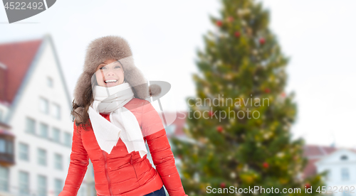 Image of happy woman over christmas tree in tallinn