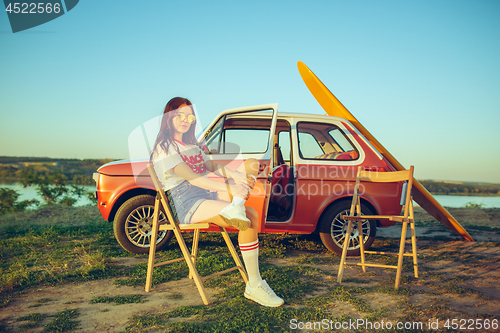 Image of Woman and happy trip by car