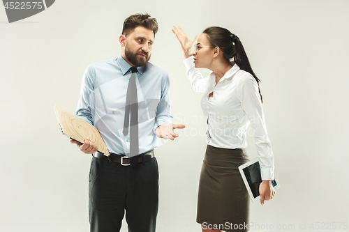 Image of Angry boss. Woman and secretary standing at office or studio