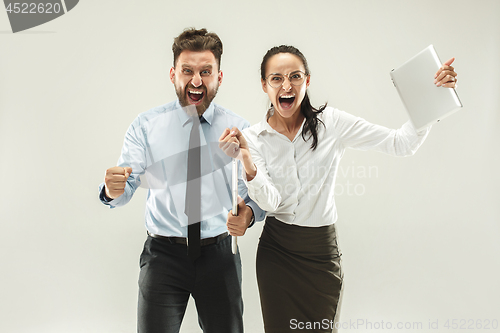 Image of Winning success woman and man happy ecstatic celebrating being a winner.